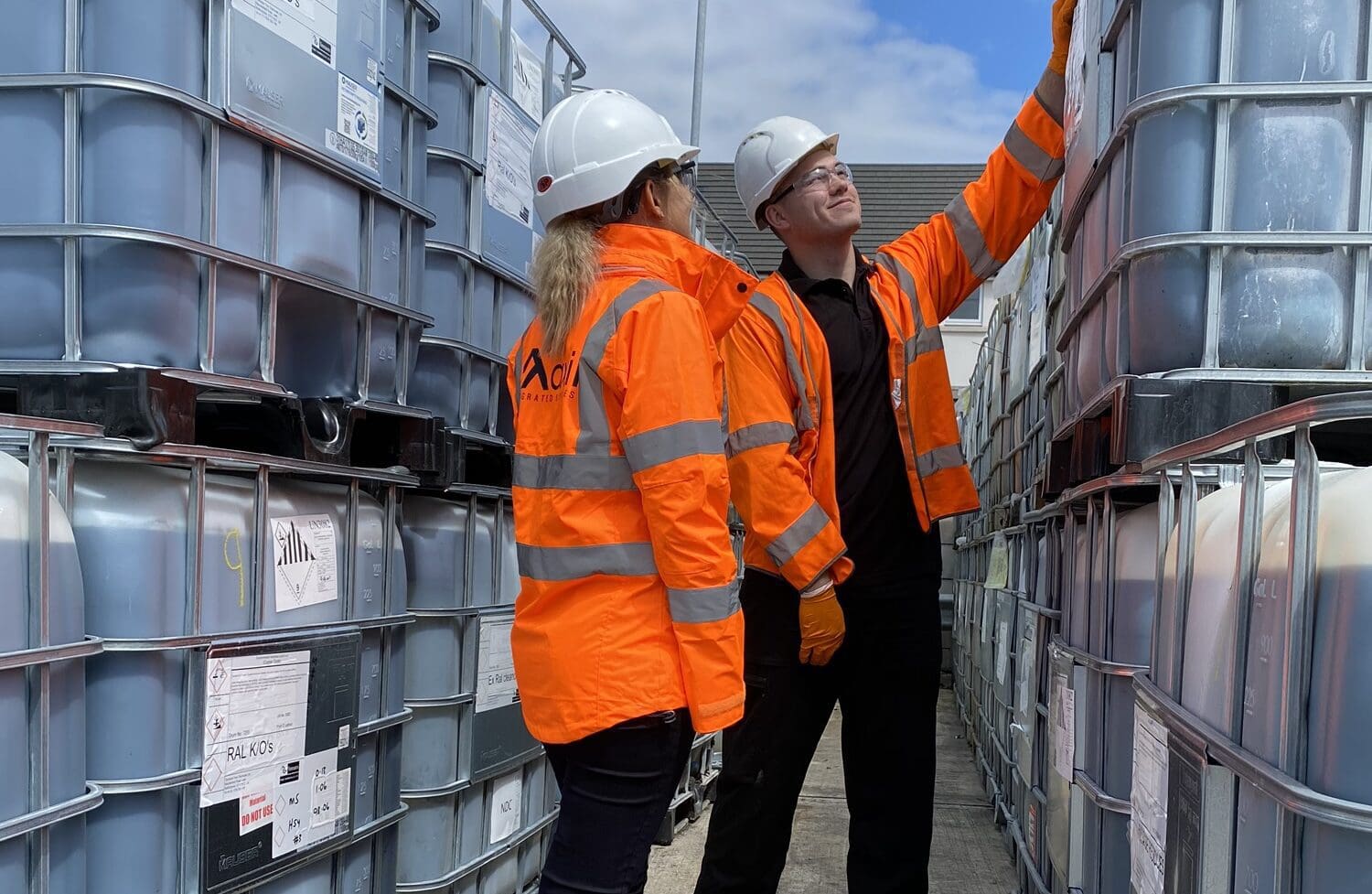 Axil employees inspecting hazardous waste drums at Cannock Waste Transfer Station