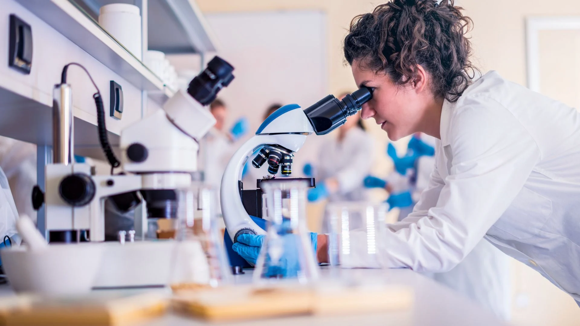 Women looking into a microscope in a science lap