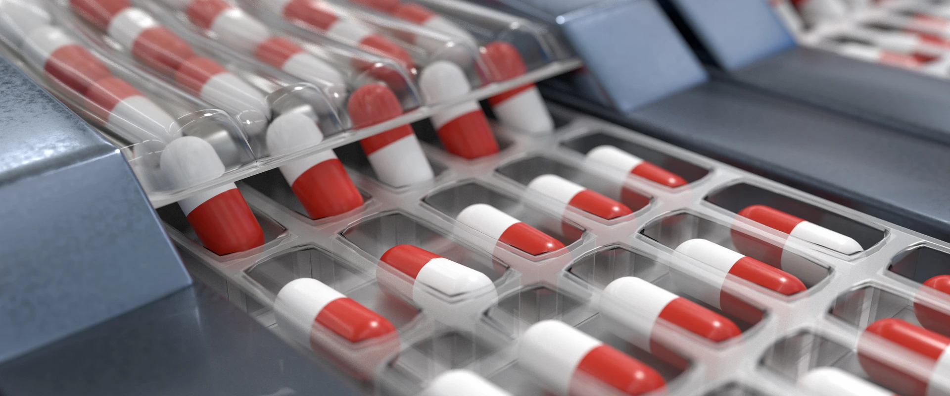 Pharmaceutical capsules moving through an automated packaging line