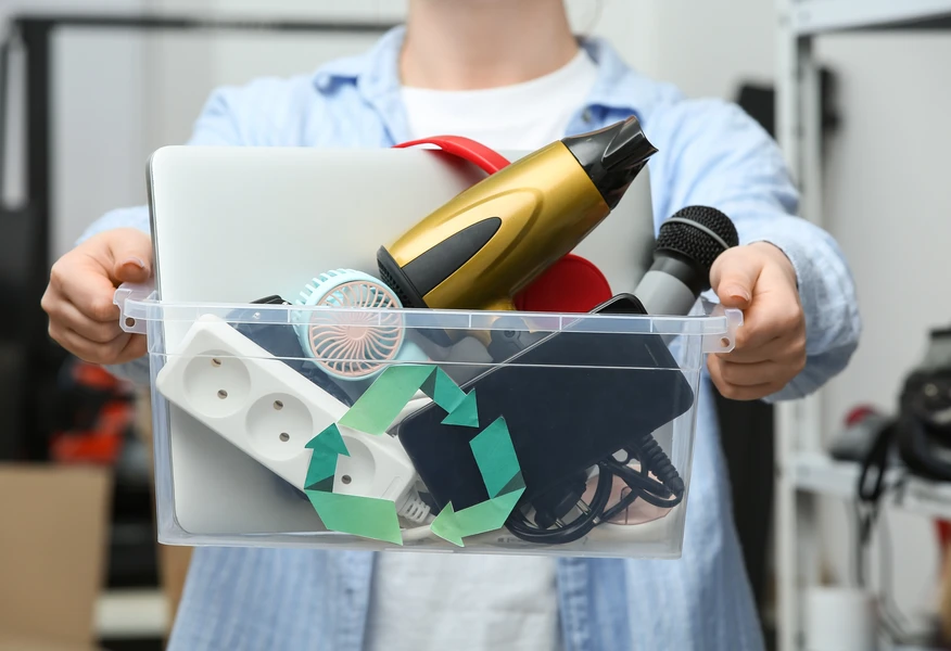 https://enterprise.shutterstock.com/image-photo/woman-holding-electronic-waste-recycling-container-2604002953